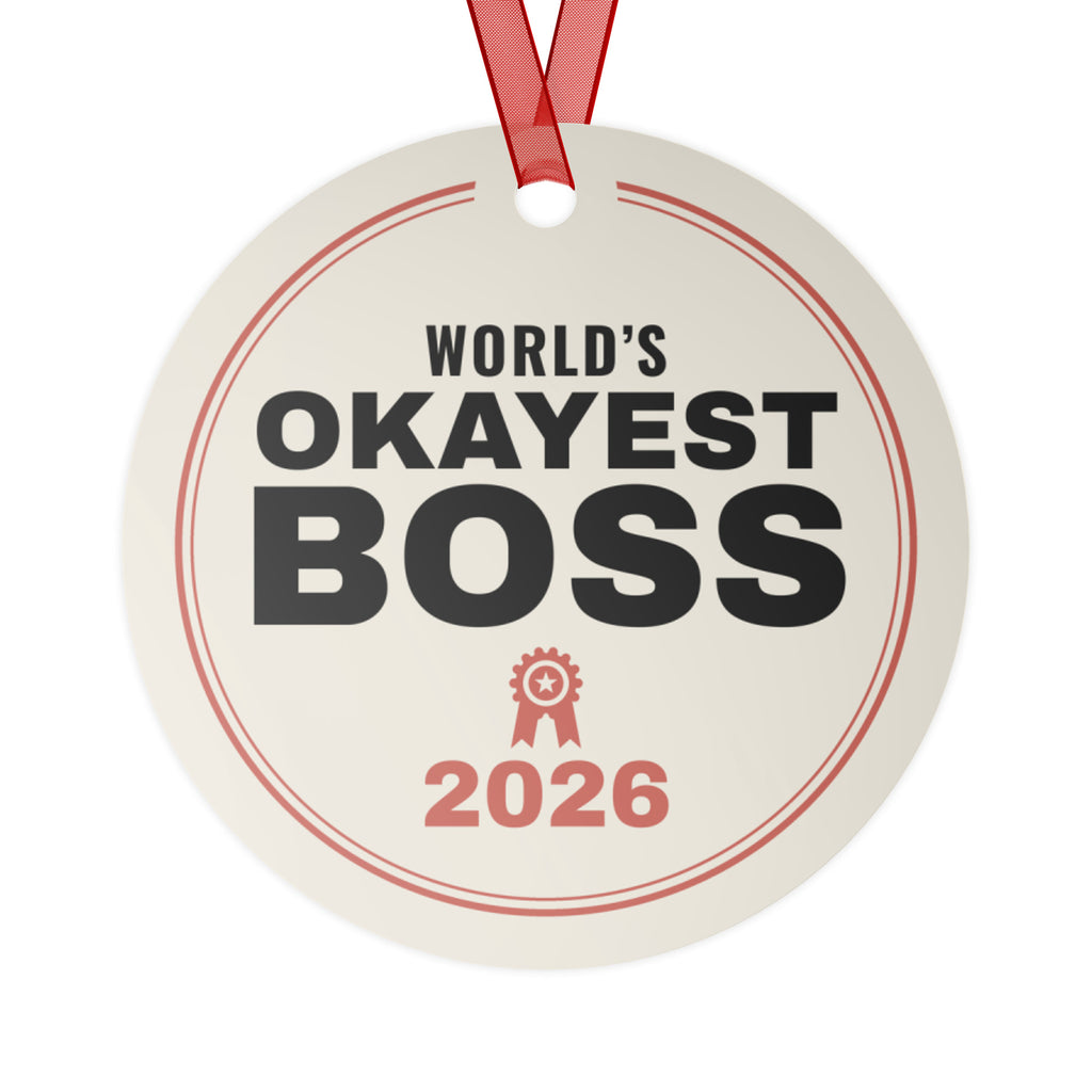 World's Okayest Boss 2026 Christmas ornament, front: cream round metal ornament reading WORLD'S OKAYEST BOSS 2026 with a red award ribbon icon, red ribbon