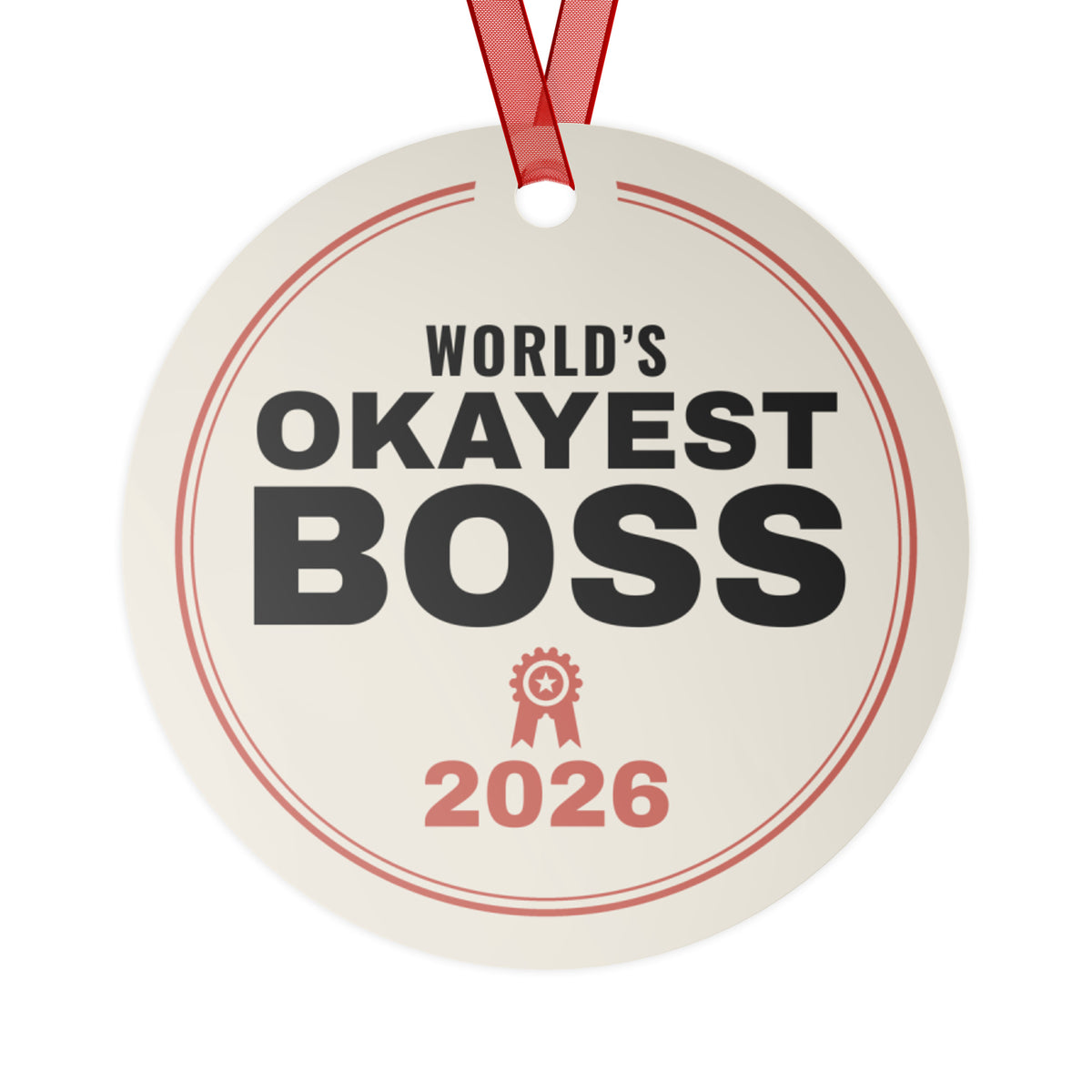 World's Okayest Boss 2026 Christmas ornament, front: cream round metal ornament reading WORLD'S OKAYEST BOSS 2026 with a red award ribbon icon, red ribbon