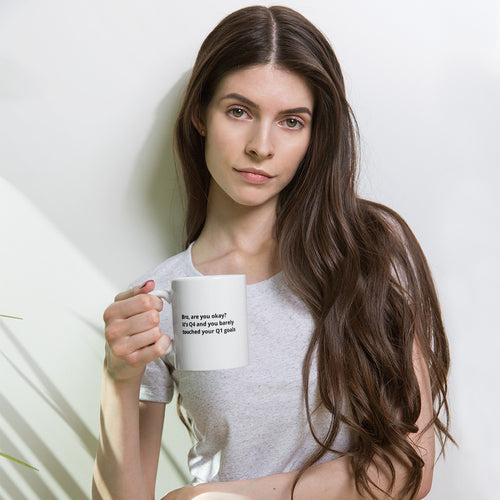 White glossy coffee mug reading Bro, are you okay? It's Q4 and you've barely touched your Q1 goals, 11 oz, held by a woman